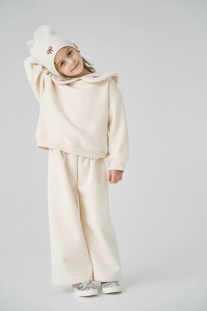 Dres kremowy z kokardkami