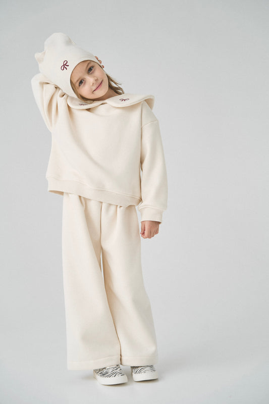 Dres kremowy z kokardkami